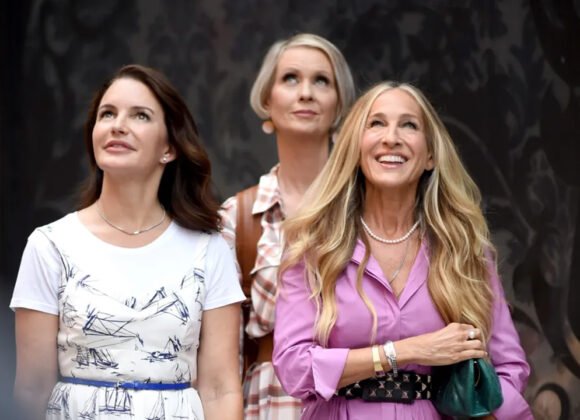 Stylized photo of Carrie, Miranda, and Charlotte walking in New York City, reimagined as empowered, modern women in their 50s